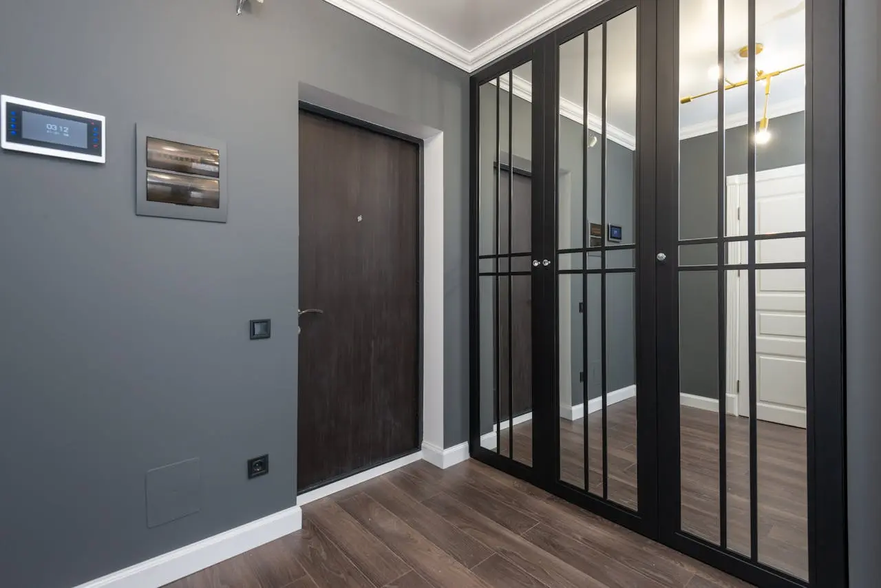 a room with a door and glass doors